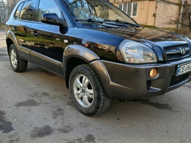 Черный Хендай Туксон, объемом двигателя 2 л и пробегом 256 тыс. км за 8000 $, фото 1 на Automoto.ua