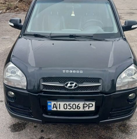 Черный Хендай Туксон, объемом двигателя 2 л и пробегом 191 тыс. км за 8300 $, фото 1 на Automoto.ua