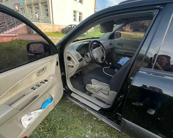 Чорний Хендай Туксон, об'ємом двигуна 1.99 л та пробігом 292 тис. км за 7500 $, фото 1 на Automoto.ua