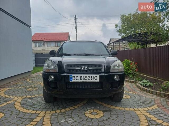 Черный Хендай Туксон, объемом двигателя 1.98 л и пробегом 237 тыс. км за 7500 $, фото 1 на Automoto.ua