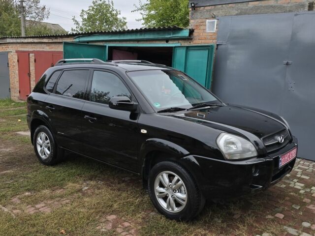 Черный Хендай Туксон, объемом двигателя 2 л и пробегом 137 тыс. км за 7499 $, фото 1 на Automoto.ua