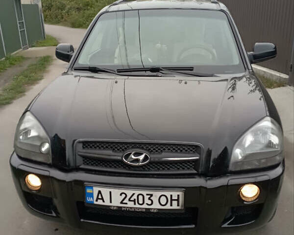 Черный Хендай Туксон, объемом двигателя 2 л и пробегом 261 тыс. км за 7500 $, фото 1 на Automoto.ua
