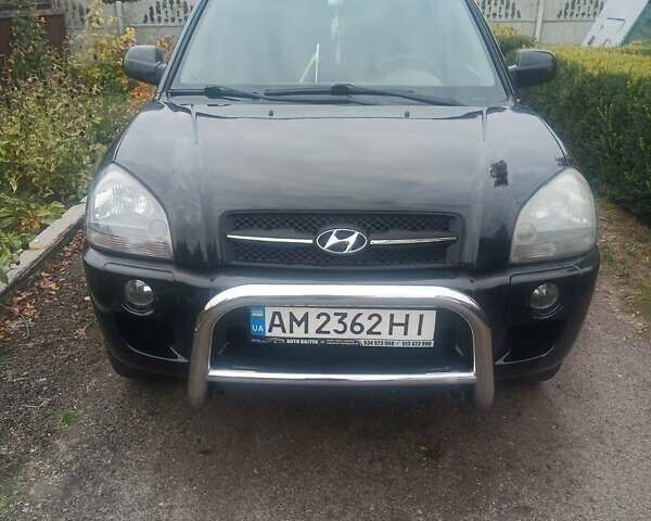 Черный Хендай Туксон, объемом двигателя 2 л и пробегом 231 тыс. км за 8500 $, фото 1 на Automoto.ua