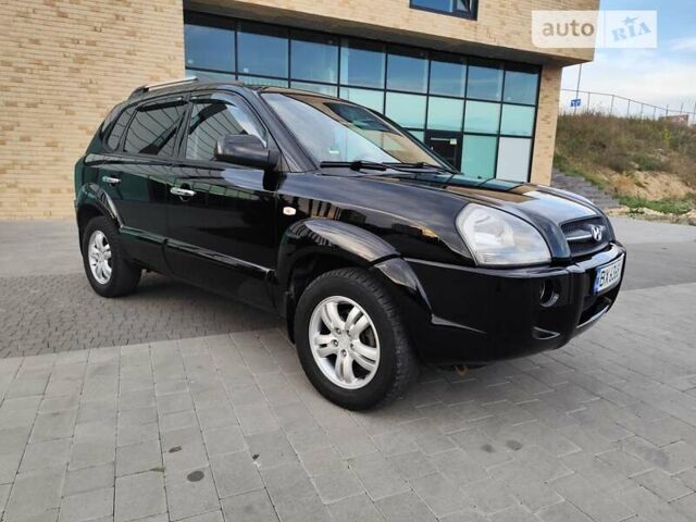 Черный Хендай Туксон, объемом двигателя 1.98 л и пробегом 243 тыс. км за 7400 $, фото 1 на Automoto.ua