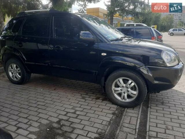 Черный Хендай Туксон, объемом двигателя 2 л и пробегом 280 тыс. км за 7400 $, фото 1 на Automoto.ua