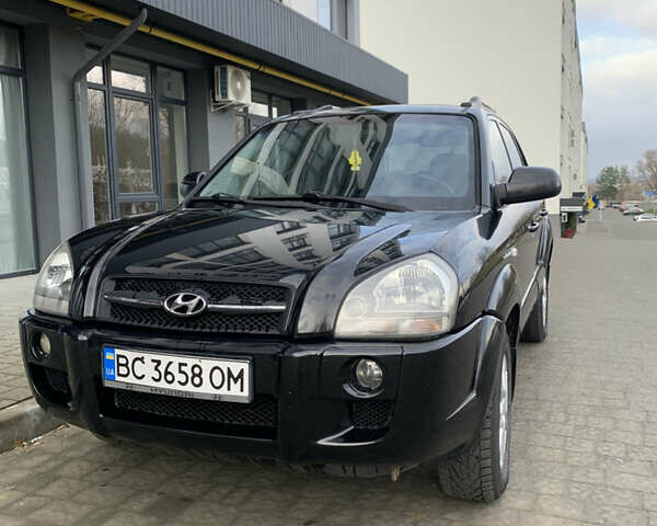 Черный Хендай Туксон, объемом двигателя 1.99 л и пробегом 290 тыс. км за 7700 $, фото 1 на Automoto.ua