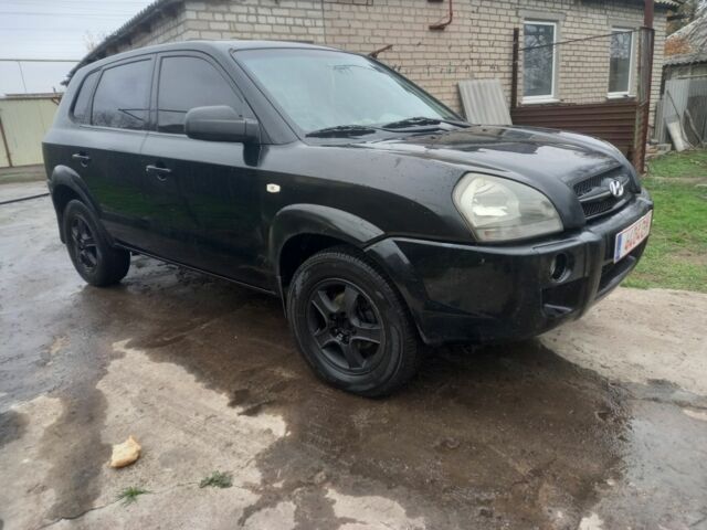Черный Хендай Туксон, объемом двигателя 2 л и пробегом 395 тыс. км за 4500 $, фото 1 на Automoto.ua