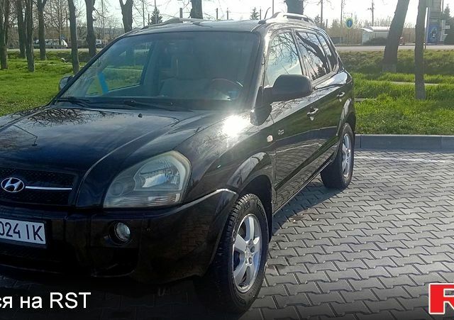 Черный Хендай Туксон, объемом двигателя 2 л и пробегом 260 тыс. км за 8000 $, фото 1 на Automoto.ua