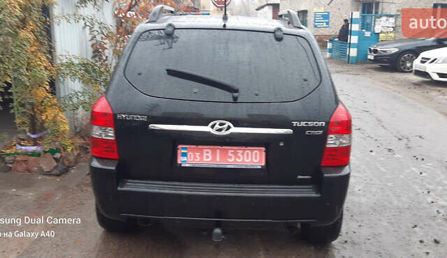 Чорний Хендай Туксон, об'ємом двигуна 1.99 л та пробігом 243 тис. км за 8850 $, фото 1 на Automoto.ua