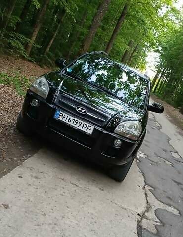 Черный Хендай Туксон, объемом двигателя 2 л и пробегом 180 тыс. км за 8600 $, фото 1 на Automoto.ua