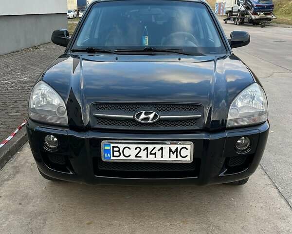 Черный Хендай Туксон, объемом двигателя 2 л и пробегом 178 тыс. км за 7700 $, фото 1 на Automoto.ua
