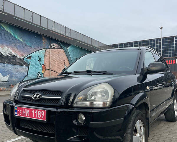 Черный Хендай Туксон, объемом двигателя 1.98 л и пробегом 170 тыс. км за 7750 $, фото 1 на Automoto.ua