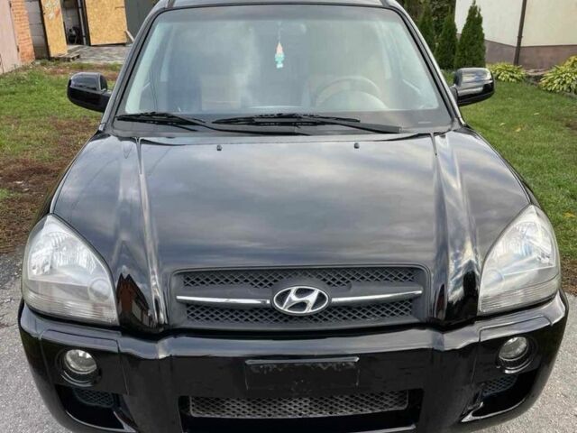 Черный Хендай Туксон, объемом двигателя 2 л и пробегом 163 тыс. км за 7700 $, фото 1 на Automoto.ua