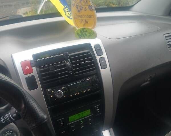 Черный Хендай Туксон, объемом двигателя 2 л и пробегом 231 тыс. км за 8000 $, фото 1 на Automoto.ua