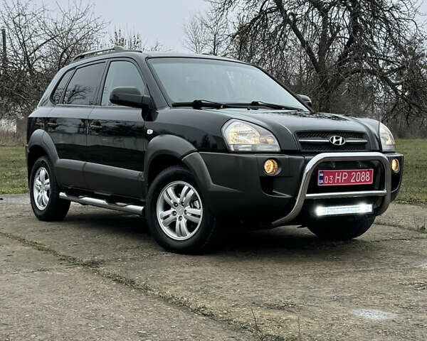 Черный Хендай Туксон, объемом двигателя 2 л и пробегом 201 тыс. км за 7750 $, фото 1 на Automoto.ua