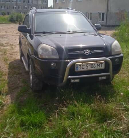 Черный Хендай Туксон, объемом двигателя 1.98 л и пробегом 222 тыс. км за 8200 $, фото 1 на Automoto.ua