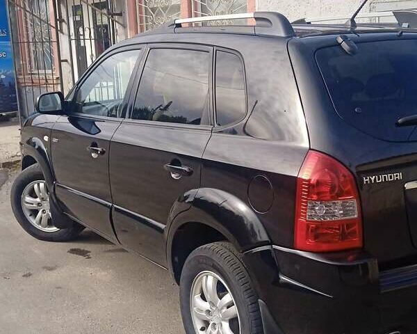 Чорний Хендай Туксон, об'ємом двигуна 1.99 л та пробігом 229 тис. км за 8199 $, фото 1 на Automoto.ua