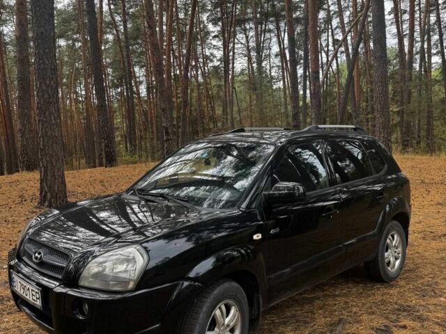 Черный Хендай Туксон, объемом двигателя 2 л и пробегом 240 тыс. км за 8800 $, фото 1 на Automoto.ua