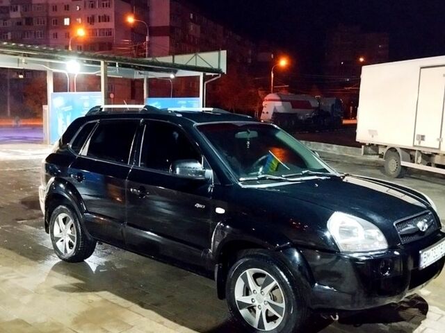 Черный Хендай Туксон, объемом двигателя 2 л и пробегом 230 тыс. км за 8600 $, фото 1 на Automoto.ua