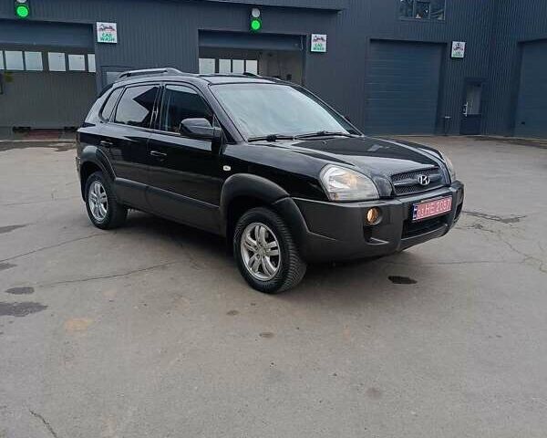 Черный Хендай Туксон, объемом двигателя 2 л и пробегом 255 тыс. км за 8400 $, фото 1 на Automoto.ua