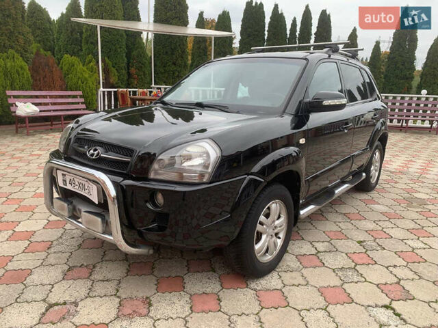 Черный Хендай Туксон, объемом двигателя 2 л и пробегом 219 тыс. км за 8600 $, фото 1 на Automoto.ua
