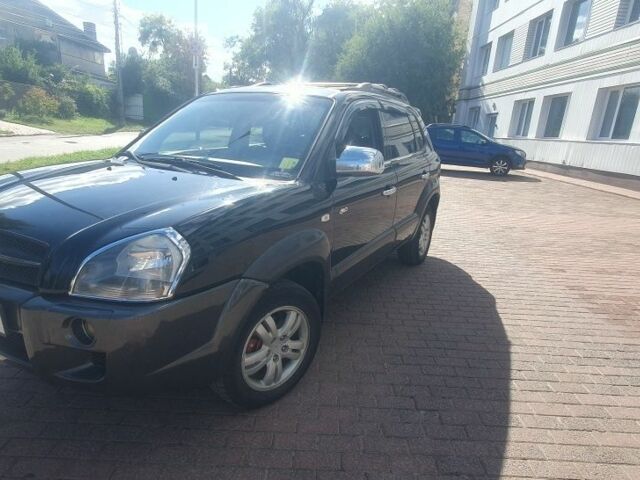 Черный Хендай Туксон, объемом двигателя 2 л и пробегом 203 тыс. км за 7600 $, фото 1 на Automoto.ua