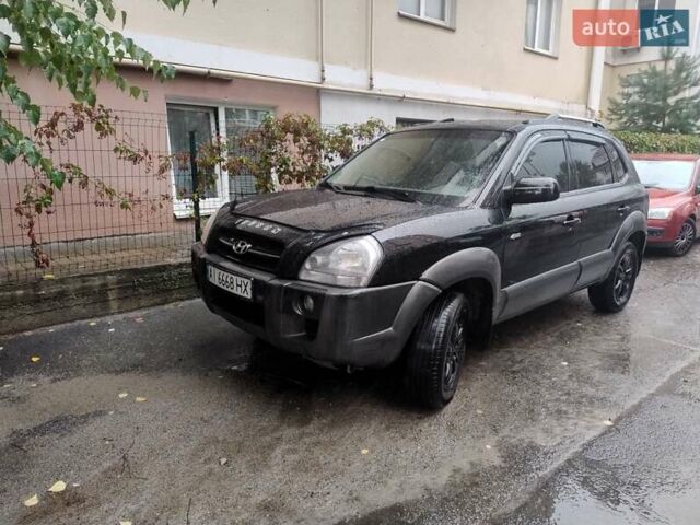 Черный Хендай Туксон, объемом двигателя 1.98 л и пробегом 234 тыс. км за 7800 $, фото 1 на Automoto.ua