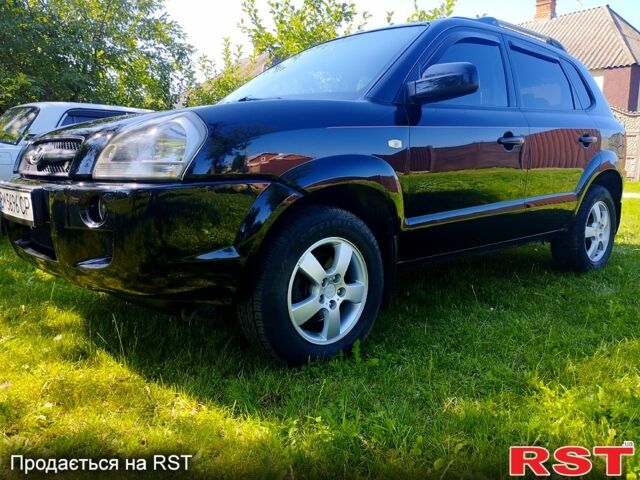 Черный Хендай Туксон, объемом двигателя 2 л и пробегом 230 тыс. км за 8000 $, фото 1 на Automoto.ua