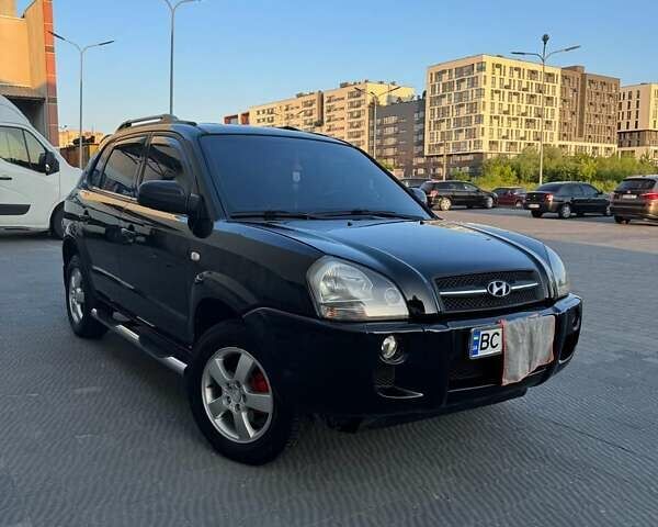 Черный Хендай Туксон, объемом двигателя 1.99 л и пробегом 231 тыс. км за 8500 $, фото 1 на Automoto.ua
