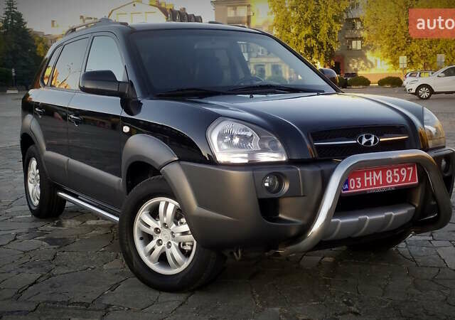 Черный Хендай Туксон, объемом двигателя 2 л и пробегом 230 тыс. км за 8600 $, фото 1 на Automoto.ua