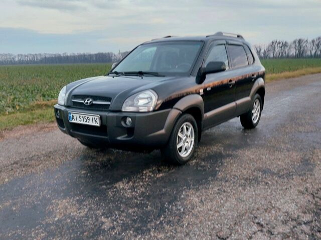 Черный Хендай Туксон, объемом двигателя 2 л и пробегом 272 тыс. км за 7500 $, фото 1 на Automoto.ua