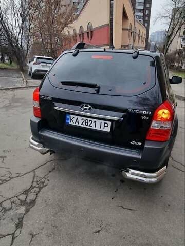 Черный Хендай Туксон, объемом двигателя 2.66 л и пробегом 311 тыс. км за 7200 $, фото 1 на Automoto.ua