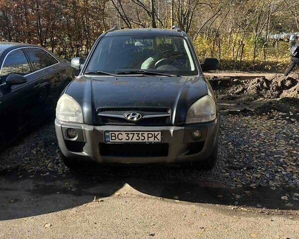Черный Хендай Туксон, объемом двигателя 2 л и пробегом 250 тыс. км за 8500 $, фото 1 на Automoto.ua