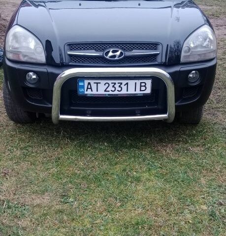 Черный Хендай Туксон, объемом двигателя 2 л и пробегом 185 тыс. км за 8300 $, фото 1 на Automoto.ua