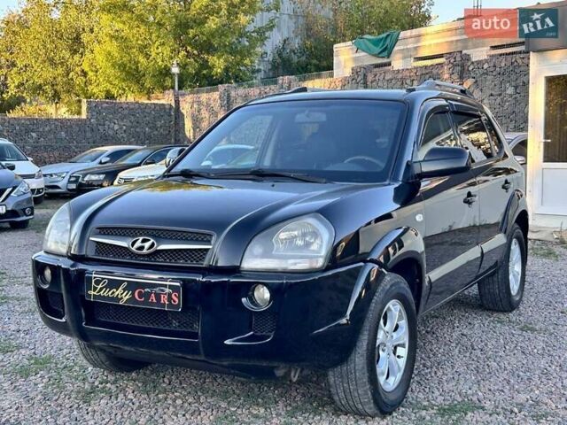 Черный Хендай Туксон, объемом двигателя 2 л и пробегом 230 тыс. км за 7500 $, фото 1 на Automoto.ua