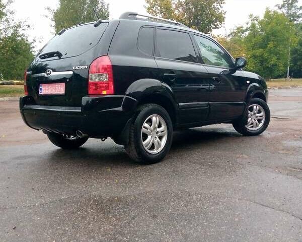 Чорний Хендай Туксон, об'ємом двигуна 2 л та пробігом 225 тис. км за 7850 $, фото 1 на Automoto.ua