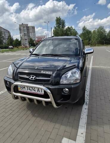 Черный Хендай Туксон, объемом двигателя 1.98 л и пробегом 42 тыс. км за 12000 $, фото 1 на Automoto.ua