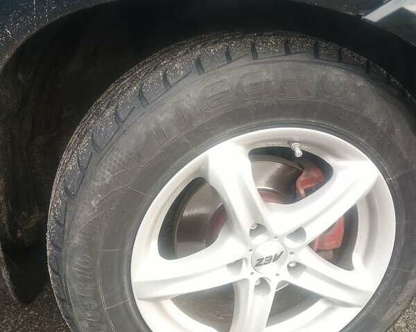 Черный Хендай Туксон, объемом двигателя 1.98 л и пробегом 283 тыс. км за 8800 $, фото 1 на Automoto.ua