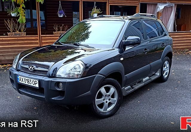 Чорний Хендай Туксон, об'ємом двигуна 2 л та пробігом 188 тис. км за 8800 $, фото 1 на Automoto.ua