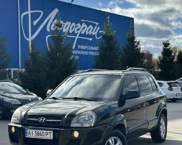 Черный Хендай Туксон, объемом двигателя 2 л и пробегом 300 тыс. км за 8300 $, фото 1 на Automoto.ua