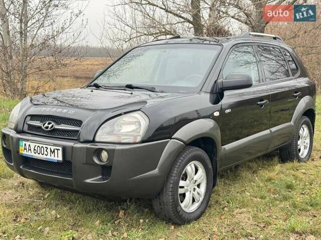Черный Хендай Туксон, объемом двигателя 2 л и пробегом 148 тыс. км за 9500 $, фото 1 на Automoto.ua