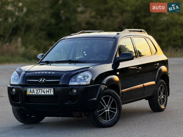 Черный Хендай Туксон, объемом двигателя 2 л и пробегом 250 тыс. км за 7600 $, фото 1 на Automoto.ua