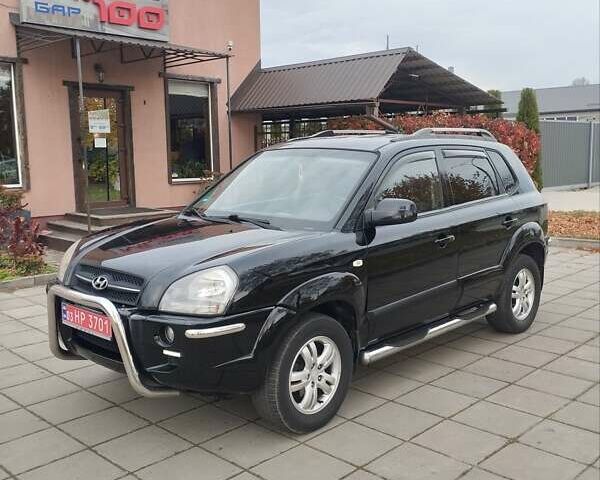 Черный Хендай Туксон, объемом двигателя 1.98 л и пробегом 214 тыс. км за 7700 $, фото 1 на Automoto.ua