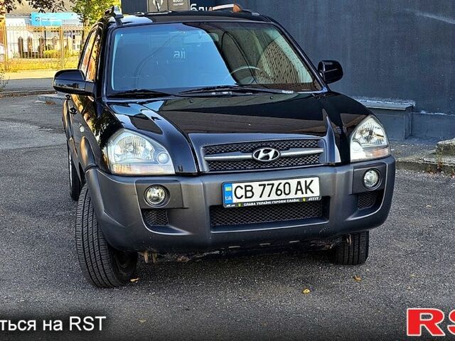 Черный Хендай Туксон, объемом двигателя 2 л и пробегом 215 тыс. км за 8350 $, фото 1 на Automoto.ua