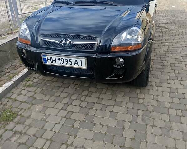 Черный Хендай Туксон, объемом двигателя 1.98 л и пробегом 51 тыс. км за 12800 $, фото 1 на Automoto.ua