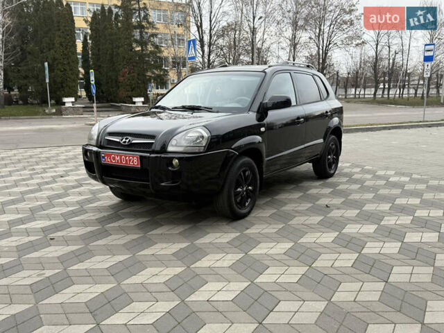 Черный Хендай Туксон, объемом двигателя 2 л и пробегом 191 тыс. км за 8500 $, фото 1 на Automoto.ua