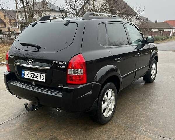 Черный Хендай Туксон, объемом двигателя 2 л и пробегом 128 тыс. км за 9200 $, фото 1 на Automoto.ua