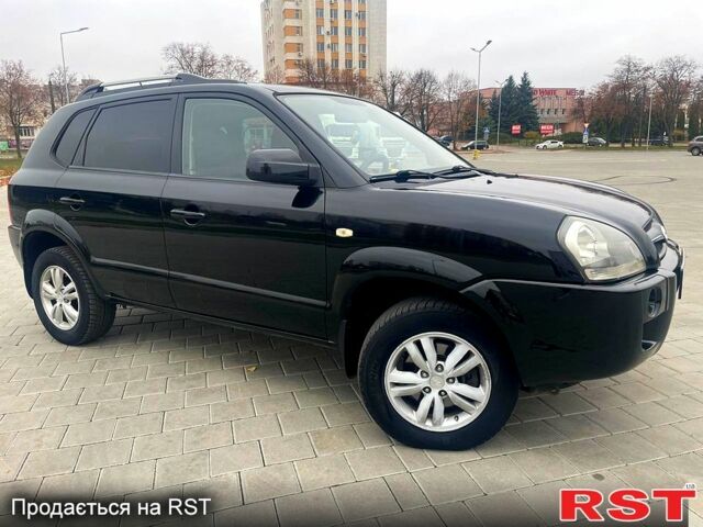 Черный Хендай Туксон, объемом двигателя 2 л и пробегом 168 тыс. км за 7700 $, фото 1 на Automoto.ua