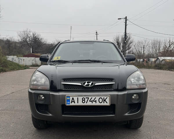 Черный Хендай Туксон, объемом двигателя 1.98 л и пробегом 120 тыс. км за 8500 $, фото 1 на Automoto.ua
