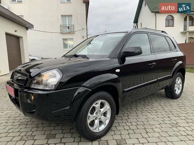 Черный Хендай Туксон, объемом двигателя 2 л и пробегом 170 тыс. км за 8850 $, фото 1 на Automoto.ua